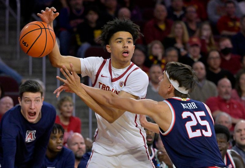 Mar 2, 2023; Los Angeles, California, USA;  Arizona Wildcats guard Kerr Kriisa (25) knocks the ball from the hands of USC Trojans guard Oziyah Sellers (4) in the first half at Galen Center. Mandatory Credit: Jayne Kamin-Oncea-USA TODAY Sports