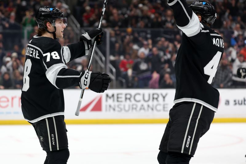 Mar 19, 2024; Los Angeles, California, USA;  Los Angeles Kings right wing Alex Laferriere (78) celebrates with defenseman Jacob Moverare (43) after scoring a goal against Chicago Blackhawks during the first period at Crypto.com Arena. Mandatory Credit: Kiyoshi Mio-USA TODAY Sports