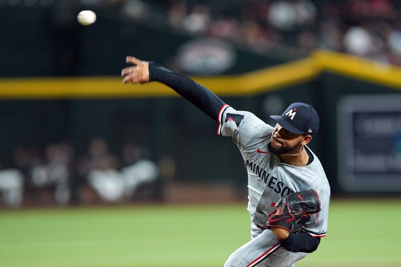 Jun 26, 2024; Phoenix, Arizona, USA; Minnesota Twins pitcher Simeon Woods Richardson (78) pitches against the Arizona Diamondbacks during the first inning at Chase Field. Mandatory Credit: Joe Camporeale-USA TODAY Sports