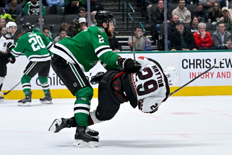 Nov 14, 2023; Dallas, Texas, USA; Dallas Stars defenseman Jani Hakanpaa (2) checks Arizona Coyotes center Barrett Hayton (29) during the third period at the American Airlines Center. Mandatory Credit: Jerome Miron-USA TODAY Sports