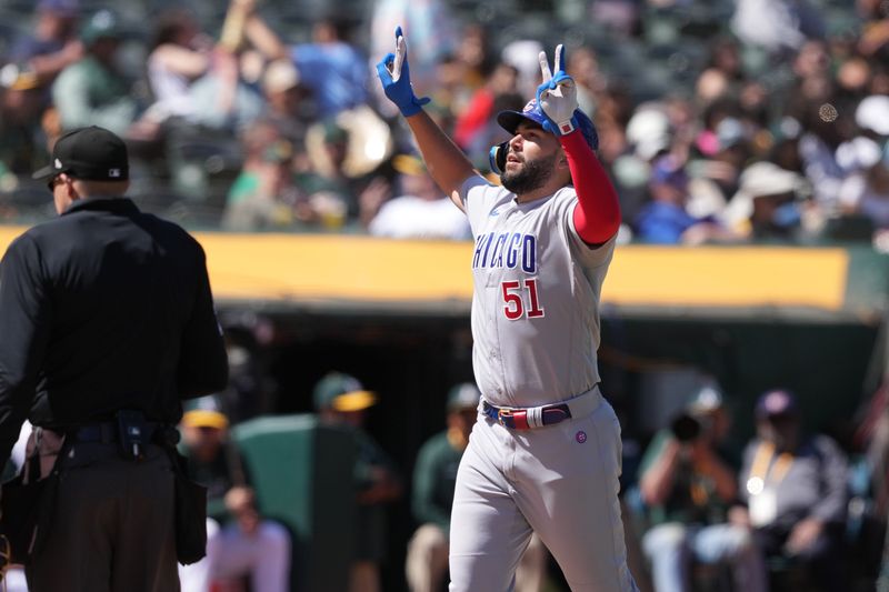 Apr 19, 2023; Oakland, California, USA; Chicago Cubs first baseman Eric Hosmer (51) gestures after hitting a home run against the Oakland Athletics during the eighth inning at Oakland-Alameda County Coliseum. Mandatory Credit: Darren Yamashita-USA TODAY Sports