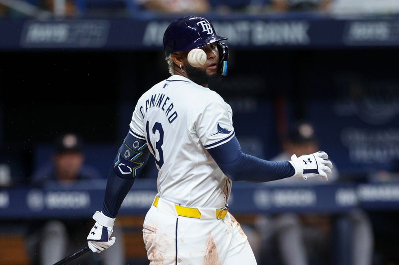 Aug 13, 2024; St. Petersburg, Florida, USA; Tampa Bay Rays third baseman Junior Caminero (13) fouls off a ball against the Houston Astros in the second inning at Tropicana Field. Mandatory Credit: Nathan Ray Seebeck-USA TODAY Sports