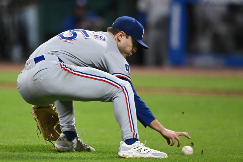 Sep 26, 2025; Cleveland, Ohio, USA; Texas Rangers starting pitcher Jack Leiter (35) fields a ball hit by Cleveland Guardians catcher Bo Naylor (not pictured) during the sixth inning at Progressive Field. Mandatory Credit: Ken Blaze-Imagn Images