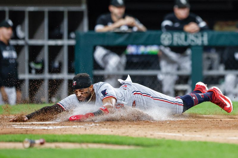 Sep 14, 2023; Chicago, Illinois, USA; Minnesota Twins left fielder Willi Castro (50) scores against the Chicago White Sox during the seventh inning at Guaranteed Rate Field. Mandatory Credit: Kamil Krzaczynski-USA TODAY Sports