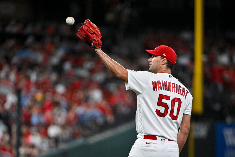 Aug 28, 2023; St. Louis, Missouri, USA;  St. Louis Cardinals starting pitcher Adam Wainwright (50) receives a new baseball during the sixth inning against the San Diego Padres at Busch Stadium. Mandatory Credit: Jeff Curry-USA TODAY Sports