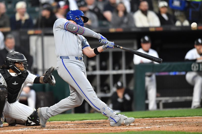 Apr 15, 2024; Chicago, Illinois, USA; Kansas City Royals first baseman Vinnie Pasquantino (9) hits a home run during the fourth inning against the Chicago White Sox at Guaranteed Rate Field. Mandatory Credit: Patrick Gorski-USA TODAY Sports