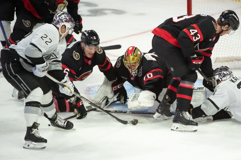 Nov 2, 2023; Ottawa, Ontario, CAN; Ottawa Senators goalie Joonas Korpisalo (70) tries to cover the puck before Los Angeles Kings left wing Kevin Fiala (22) shoots on net in the third period at the Canadian Tire Centre. Mandatory Credit: Marc DesRosiers-USA TODAY Sports