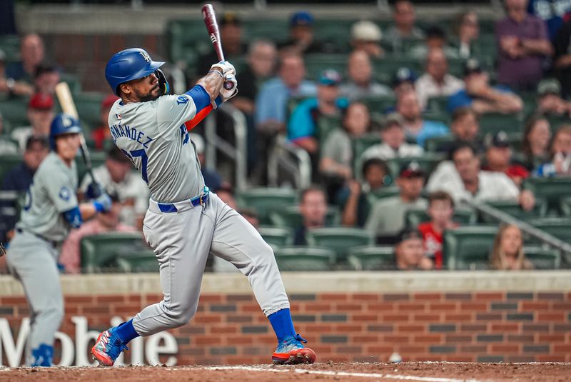 Sep 15, 2024; Cumberland, Georgia, USA; Los Angeles Dodgers left fielder Teoscar Hernandez (37) hits a two run home run against the Atlanta Braves during the ninth inning at Truist Park. Mandatory Credit: Dale Zanine-Imagn Images