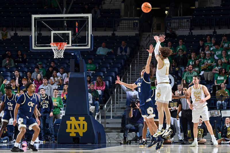 Feb 14, 2024; South Bend, Indiana, USA; Notre Dame Fighting Irish guard Braeden Shrewsberry (11) shoots a three point basket over Georgia Tech Yellow Jackets guard Naithan George (2) in the first half at the Purcell Pavilion. Mandatory Credit: Matt Cashore-USA TODAY Sports