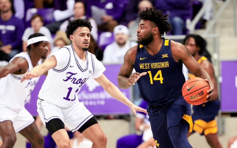 Feb 12, 2024; Fort Worth, Texas, USA;  West Virginia Mountaineers guard Seth Wilson (14) controls the ball as TCU Horned Frogs guard Trevian Tennyson (11) defends during the first half at Ed and Rae Schollmaier Arena. Mandatory Credit: Kevin Jairaj-USA TODAY Sports