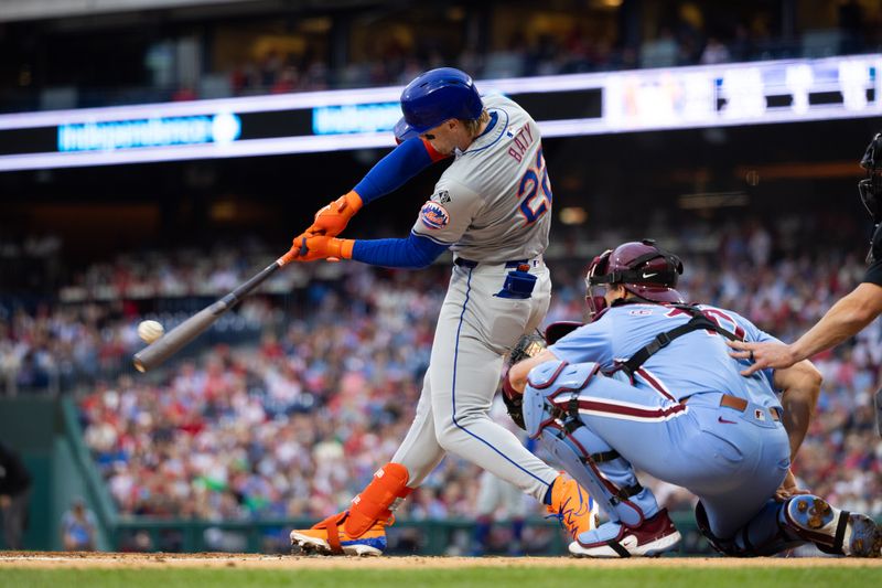 May 16, 2024; Philadelphia, Pennsylvania, USA; New York Mets third base Brett Baty (22) hits an RBI double during the second inning against the Philadelphia Phillies at Citizens Bank Park. Mandatory Credit: Bill Streicher-USA TODAY Sports