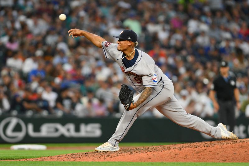 Jul 19, 2024; Seattle, Washington, USA; Houston Astros relief pitcher Bryan Abreu (52) pitches to the Seattle Mariners during the seventh inning at T-Mobile Park. Mandatory Credit: Steven Bisig-USA TODAY Sports