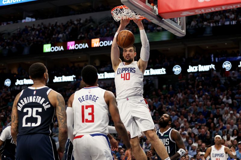 DALLAS, TEXAS - APRIL 28: Ivica Zubac #40 of the Los Angeles Clippers dunks the ball in the second half against the Dallas Mavericks during game four of the Western Conference First Round Playoffs at American Airlines Center on April 28, 2024 in Dallas, Texas.  NOTE TO USER: User expressly acknowledges and agrees that, by downloading and or using this photograph, User is consenting to the terms and conditions of the Getty Images License Agreement. (Photo by Tim Warner/Getty Images)