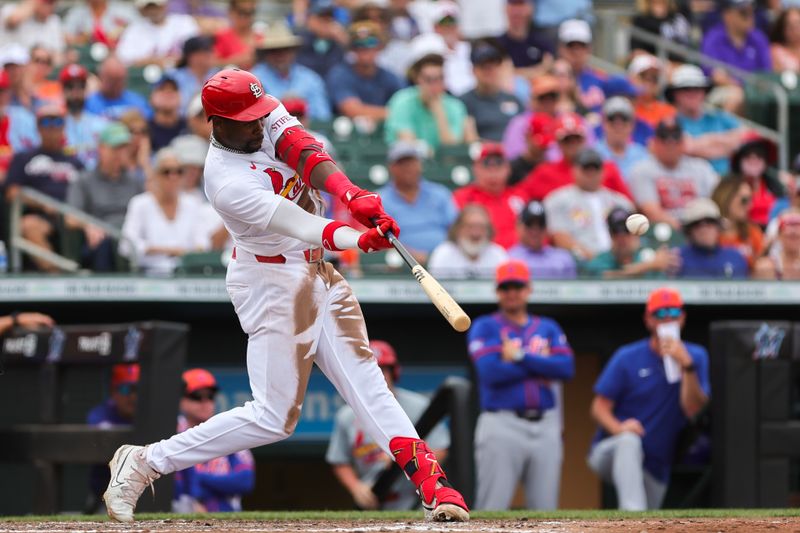 Mar 1, 2024; Jupiter, Florida, USA; St. Louis Cardinals right fielder Jordan Walker (18) hits a triple against the New York Mets during the fourth inning at Roger Dean Chevrolet Stadium. Mandatory Credit: Sam Navarro-USA TODAY Sports