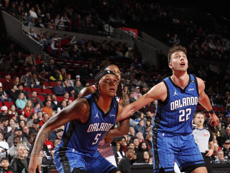 PORTLAND, OR - JANUARY 30:  Paolo Banchero #5 of the Orlando Magic boxes out during the game against the Portland Trail Blazers on January 30, 2025 at the Moda Center Arena in Portland, Oregon. NOTE TO USER: User expressly acknowledges and agrees that, by downloading and or using this photograph, user is consenting to the terms and conditions of the Getty Images License Agreement. Mandatory Copyright Notice: Copyright 2025 NBAE (Photo by Cameron Browne/NBAE via Getty Images)