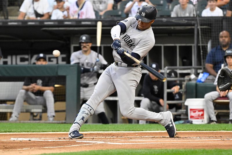Aug 14, 2024; Chicago, Illinois, USA;  New York Yankees outfielder Juan Soto (22) hits a home run against the Chicago White Sox during the first inning at Guaranteed Rate Field. Mandatory Credit: Matt Marton-USA TODAY Sports