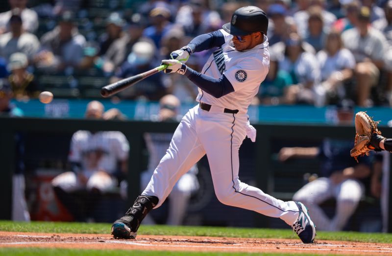 Jun 5, 2025; Seattle, Washington, USA;  Seattle Mariners designated hitter Jorge Polanco (7) hits a double during the first inning against the Baltimore Orioles at T-Mobile Park. Mandatory Credit: Stephen Brashear-Imagn Images