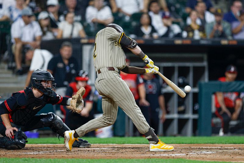 Sep 19, 2025; Chicago, Illinois, USA; San Diego Padres first baseman Ryan O'Hearn (32) hits an RBI-single against the Chicago White Sox during the fourth inning at Rate Field. Mandatory Credit: Kamil Krzaczynski-Imagn Images