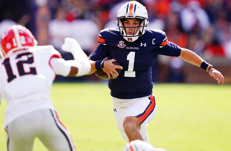 Sep 30, 2023; Auburn, Alabama, USA; Auburn Tigers quarterback Payton Thorne (1) scrambles up the field against the Georgia Bulldogs during the first quarter at Jordan-Hare Stadium. Mandatory Credit: John David Mercer-USA TODAY Sports