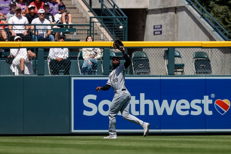 Aug 20, 2023; Denver, Colorado, USA; Chicago White Sox center fielder Luis Robert Jr. (88) makes a catch in the second inning against the Colorado Rockies at Coors Field. Mandatory Credit: Isaiah J. Downing-USA TODAY Sports