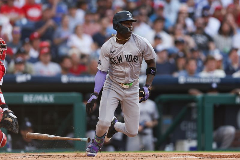 Jul 30, 2024; Philadelphia, Pennsylvania, USA; New York Yankees third base Jazz Chisholm Jr. (13) hits an RBI fielders choice during the first inning against the Philadelphia Phillies at Citizens Bank Park. Mandatory Credit: Bill Streicher-USA TODAY Sports