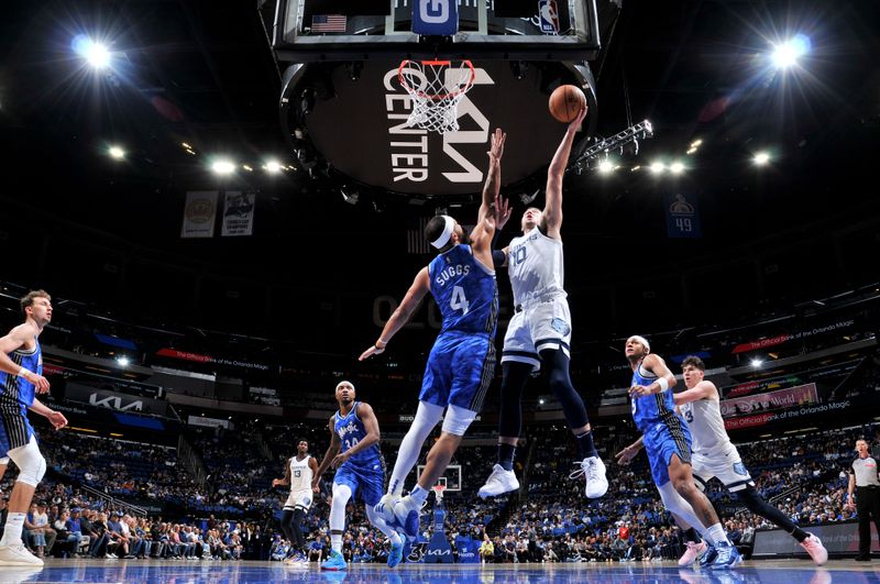 ORLANDO, FL - MARCH 30: Luke Kennard #10 of the Memphis Grizzlies drives to the basket during the game against the Orlando Magic on March 30, 2024 at the Kia Center in Orlando, Florida. NOTE TO USER: User expressly acknowledges and agrees that, by downloading and or using this photograph, User is consenting to the terms and conditions of the Getty Images License Agreement. Mandatory Copyright Notice: Copyright 2024 NBAE (Photo by Fernando Medina/NBAE via Getty Images)