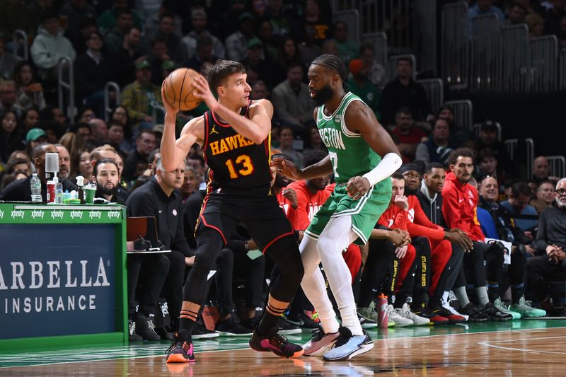 BOSTON, MA - FEBRUARY 7: Bogdan Bogdanovic #13 of the Atlanta Hawks looks to pass the ball during the game against the Boston Celtics on February 7, 2024 at the TD Garden in Boston, Massachusetts. NOTE TO USER: User expressly acknowledges and agrees that, by downloading and or using this photograph, User is consenting to the terms and conditions of the Getty Images License Agreement. Mandatory Copyright Notice: Copyright 2024 NBAE  (Photo by Brian Babineau/NBAE via Getty Images)