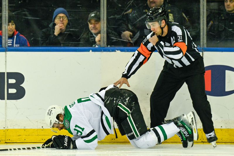 Dec 2, 2025; New York, New York, USA;  Dallas Stars center Tyler Seguin (91) injured in the game against the New York Rangers during the first period at Madison Square Garden. Mandatory Credit: Dennis Schneidler-Imagn Images