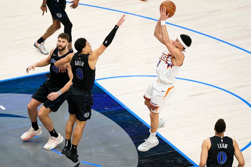 DALLAS, TEXAS - JANUARY 24: Devin Booker #1 of the Phoenix Suns shoots as Josh Green #8 of the Dallas Mavericks defends during the second half at American Airlines Center on January 24, 2024 in Dallas, Texas. NOTE TO USER: User expressly acknowledges and agrees that, by downloading and or using this photograph, User is consenting to the terms and conditions of the Getty Images License Agreement. (Photo by Sam Hodde/Getty Images)