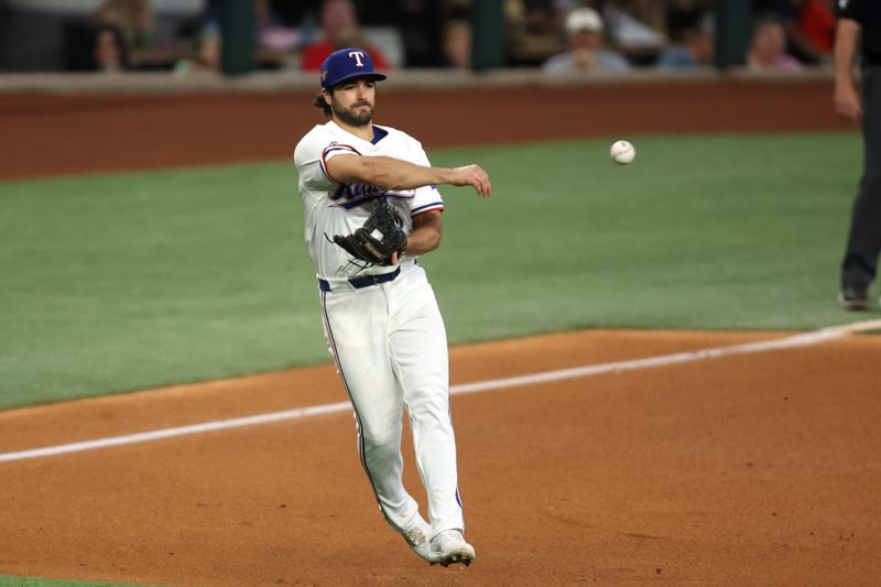 Jun 22, 2024; Arlington, Texas, USA; Texas Rangers third base Josh Smith (8) throws the ball to first base in the fifth inning against the Kansas City Royals at Globe Life Field. Mandatory Credit: Tim Heitman-USA TODAY Sports