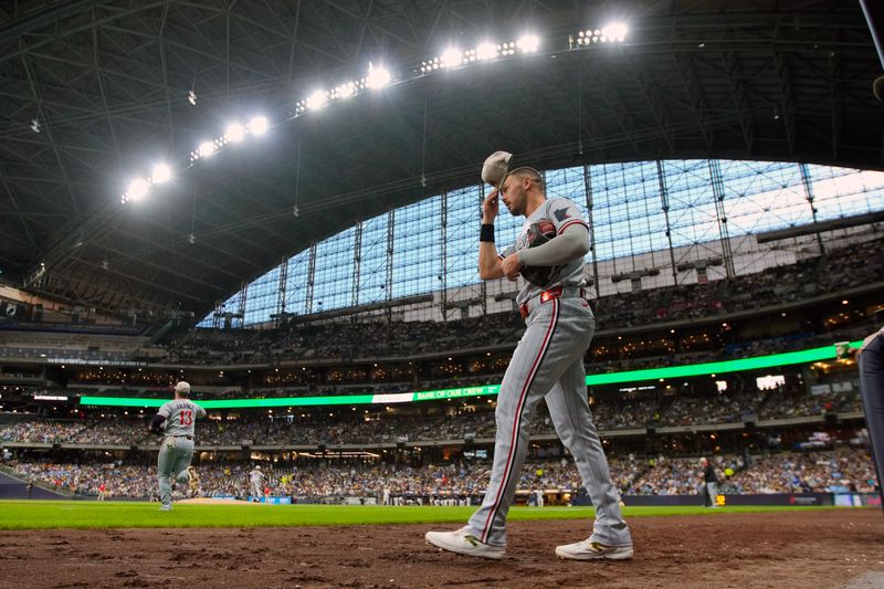 May 16, 2025; Milwaukee, Wisconsin, USA;  Minnesota Twins right fielder Trevor Larnach (9) walks onto the field between innings during the game against the Milwaukee Brewers at American Family Field. Mandatory Credit: Jeff Hanisch-Imagn Images