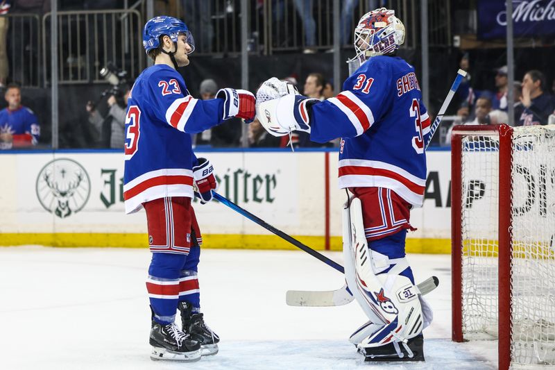 Apr 21, 2024; New York, New York, USA; New York Rangers defenseman Adam Fox (23) and goaltender Igor Shesterkin (31) congratulate each other after defeating the Washington Capitals 4-1 in game one of the first round of the 2024 Stanley Cup Playoffs at Madison Square Garden. Mandatory Credit: Wendell Cruz-USA TODAY Sports