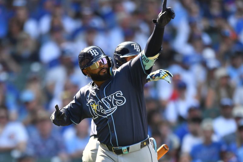 Sep 13, 2025; Chicago, Illinois, USA; Tampa Bay Rays third baseman Junior Caminero (13) celebrates with right fielder Josh Lowe (15) after hitting a solo home run against the Chicago Cubs during the eighth inning at Wrigley Field. Mandatory Credit: Patrick Gorski-Imagn Images