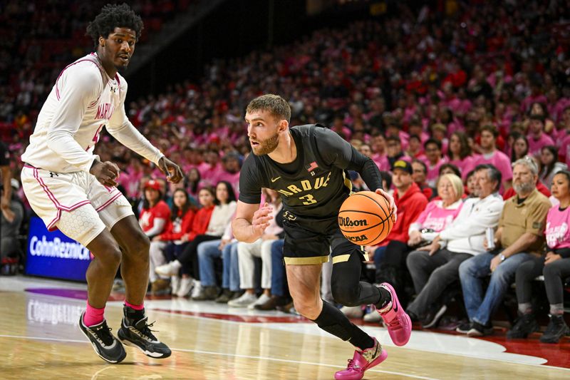 Feb 1, 2026; College Park, Maryland, USA;  Purdue Boilermakers guard Braden Smith (3) dribble by Maryland Terrapins forward Solomon Washington (9) during the first half at Xfinity Center. Mandatory Credit: Tommy Gilligan-Imagn Images