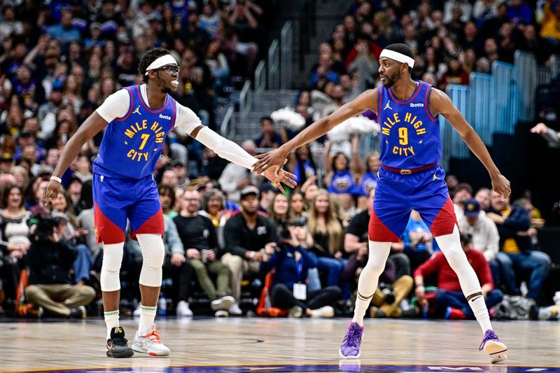 DENVER, COLORADO - MARCH 9: Justin Holiday #9 and Reggie Jackson #7 of the Denver Nuggets celebrate after a made three-point shot by Jackson in the first half of a game against the Utah Jazz at Ball Arena on March 9, 2024 in Denver, Colorado. (Photo by Dustin Bradford/Getty Images)