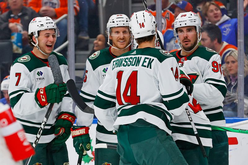 Dec 8, 2023; Edmonton, Alberta, CAN; The Minnesota Wild celebrate a goal scored by  forward Matt Boldy (12) during the second period against the Edmonton Oilers at Rogers Place. Mandatory Credit: Perry Nelson-USA TODAY Sports.