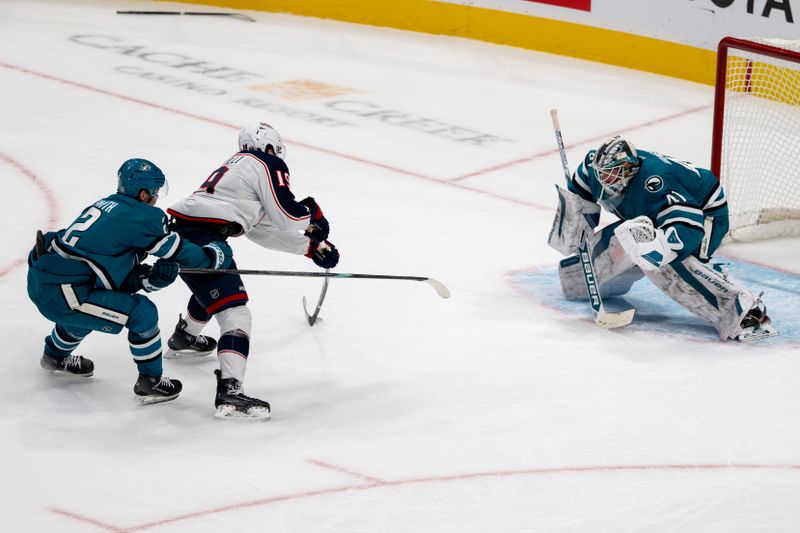 Nov 5, 2024; San Jose, California, USA;  Columbus Blue Jackets center Adam Fantilli (19) shoots the puck against San Jose Sharks goaltender Vitek Vanecek (41) during overtime at SAP Center at San Jose. Mandatory Credit: Neville E. Guard-Imagn Images