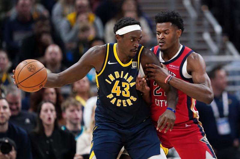 INDIANAPOLIS, INDIANA - NOVEMBER 25: Pascal Siakam #43 of the Indiana Pacers dribbles the ball while being guarded by Yves Missi #21 of the New Orleans Pelicans in the third quarter at Gainbridge Fieldhouse on November 25, 2024 in Indianapolis, Indiana. NOTE TO USER: User expressly acknowledges and agrees that, by downloading and or using this photograph, User is consenting to the terms and conditions of the Getty Images License Agreement. (Photo by Dylan Buell/Getty Images)