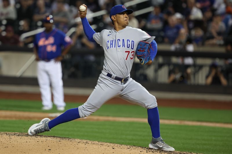 Aug 8, 2023; New York City, New York, USA; Chicago Cubs relief pitcher Adbert Alzolay (73) delivers a pitch during the ninth inning against the New York Mets at Citi Field. Mandatory Credit: Vincent Carchietta-USA TODAY Sports