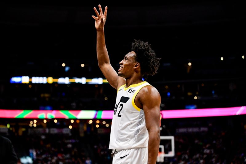 DENVER, COLORADO - MARCH 9: Collin Sexton #2 of the Utah Jazz waves to the crowd in the second half of a game against the Denver Nuggets at Ball Arena on March 9, 2024 in Denver, Colorado. (Photo by Dustin Bradford/Getty Images)