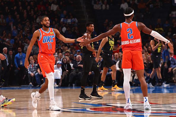 OKLAHOMA CITY, OK - DECEMBER 11: Isaiah Joe #11 of the Oklahoma City Thunder high fives Shai Gilgeous-Alexander #2 of the Oklahoma City Thunder during the game against the Utah Jazz on December 11, 2023 at Paycom Arena in Oklahoma City, Oklahoma. NOTE TO USER: User expressly acknowledges and agrees that, by downloading and or using this photograph, User is consenting to the terms and conditions of the Getty Images License Agreement. Mandatory Copyright Notice: Copyright 2023 NBAE (Photo by Zach Beeker/NBAE via Getty Images)