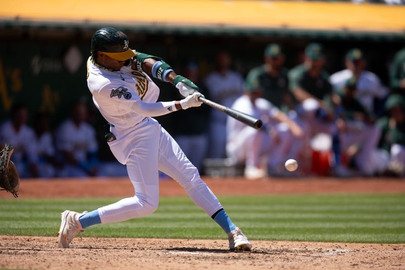 Jun 18, 2023; Oakland, California, USA; Oakland Athletics pinch hitter Esteury Ruiz (1) hits a double against the Philadelphia Phillies during the inning at Oakland-Alameda County Coliseum. Mandatory Credit: D. Ross Cameron-USA TODAY Sports