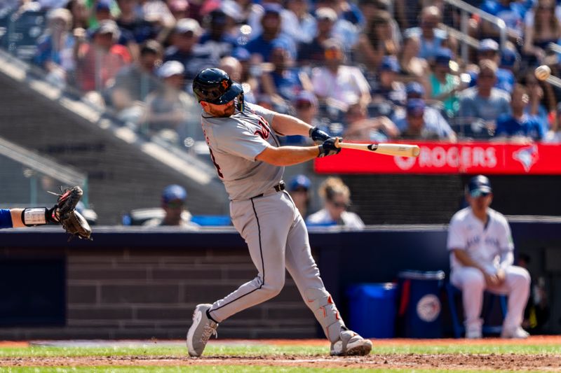 Jul 20, 2024; Toronto, Ontario, CAN; Detroit Tigers catcher Jake Rogers (34) hits a home run against the Toronto Blue Jays during the sixth inning at Rogers Centre. Mandatory Credit: Kevin Sousa-USA TODAY Sports