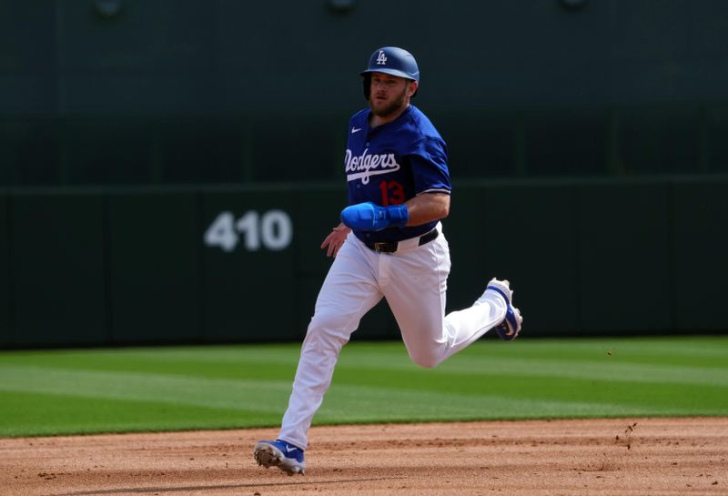 Feb 27, 2024; Phoenix, Arizona, USA; Los Angeles Dodgers third baseman Max Muncy (13) runs the bases against the Chicago White Sox during the first inning at Camelback Ranch-Glendale. Mandatory Credit: Joe Camporeale-USA TODAY Sports