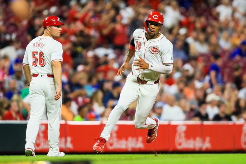 Jul 30, 2024; Cincinnati, Ohio, USA; Cincinnati Reds outfielder Will Benson (30) scores on a RBI double hit by outfielder Spencer Steer (not pictured) in the eighth inning against the Chicago Cubs at Great American Ball Park. Mandatory Credit: Katie Stratman-USA TODAY Sports