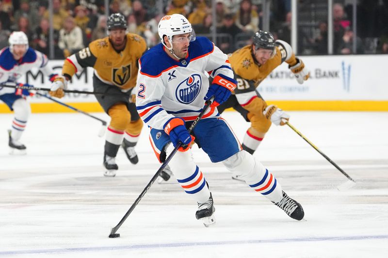 Apr 1, 2025; Las Vegas, Nevada, USA; Edmonton Oilers defenseman Evan Bouchard (2) skates against the Vegas Golden Knights during the first period at T-Mobile Arena. Mandatory Credit: Stephen R. Sylvanie-Imagn Images