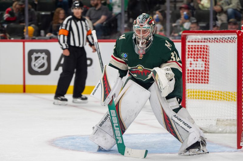 Oct 1, 2024; Saint Paul, Minnesota, USA; Minnesota Wild goaltender Filip Gustavsson (32) awaits the face off against the Chicago Blackhawks in the first period at Xcel Energy Center. Mandatory Credit: Matt Blewett-Imagn Images