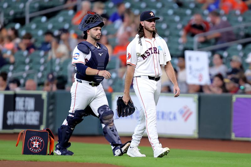 Jun 26, 2024; Houston, Texas, USA; Houston Astros catcher Cesar Salazar and Houston Astros starting pitcher Spencer Arrighetti (41) walk to the dugout after warming up before a game against the Colorado Rockies at Minute Maid Park. Mandatory Credit: Erik Williams-USA TODAY Sports