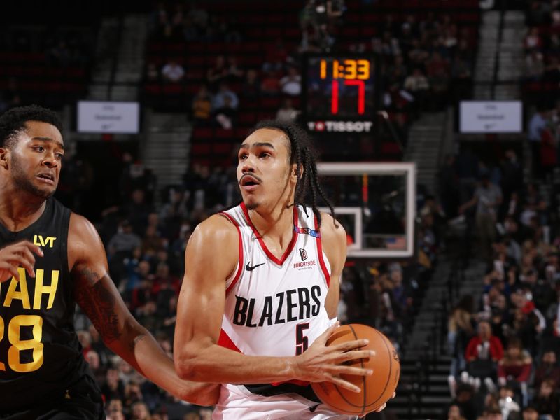 PORTLAND, OR - OCTOBER 18: Dalano Banton #5 of the Portland Trail Blazers handles the ball during the game against the Utah Jazz on October 18, 2024 at the Moda Center Arena in Portland, Oregon. NOTE TO USER: User expressly acknowledges and agrees that, by downloading and or using this photograph, user is consenting to the terms and conditions of the Getty Images License Agreement. Mandatory Copyright Notice: Copyright 2024 NBAE (Photo by Cameron Browne/NBAE via Getty Images)