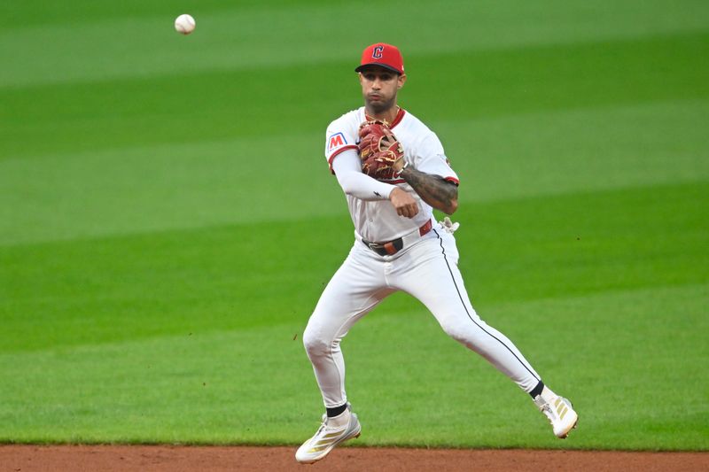 Sep 9, 2025; Cleveland, Ohio, USA; Cleveland Guardians shortstop Brayan Rocchio (4) throws to first base in the fourth inning against the Kansas City Royals at Progressive Field. Mandatory Credit: David Richard-Imagn Images